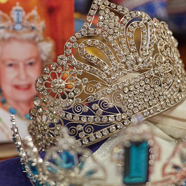 close up of crown and picture of Queen Elizabeth II
