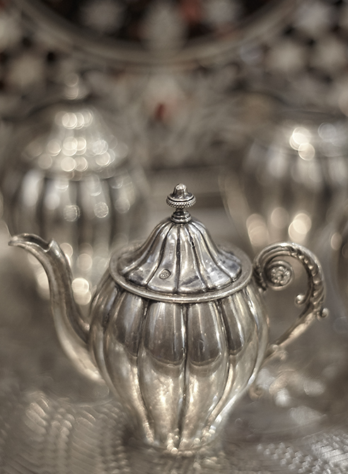 close up of silver tea set