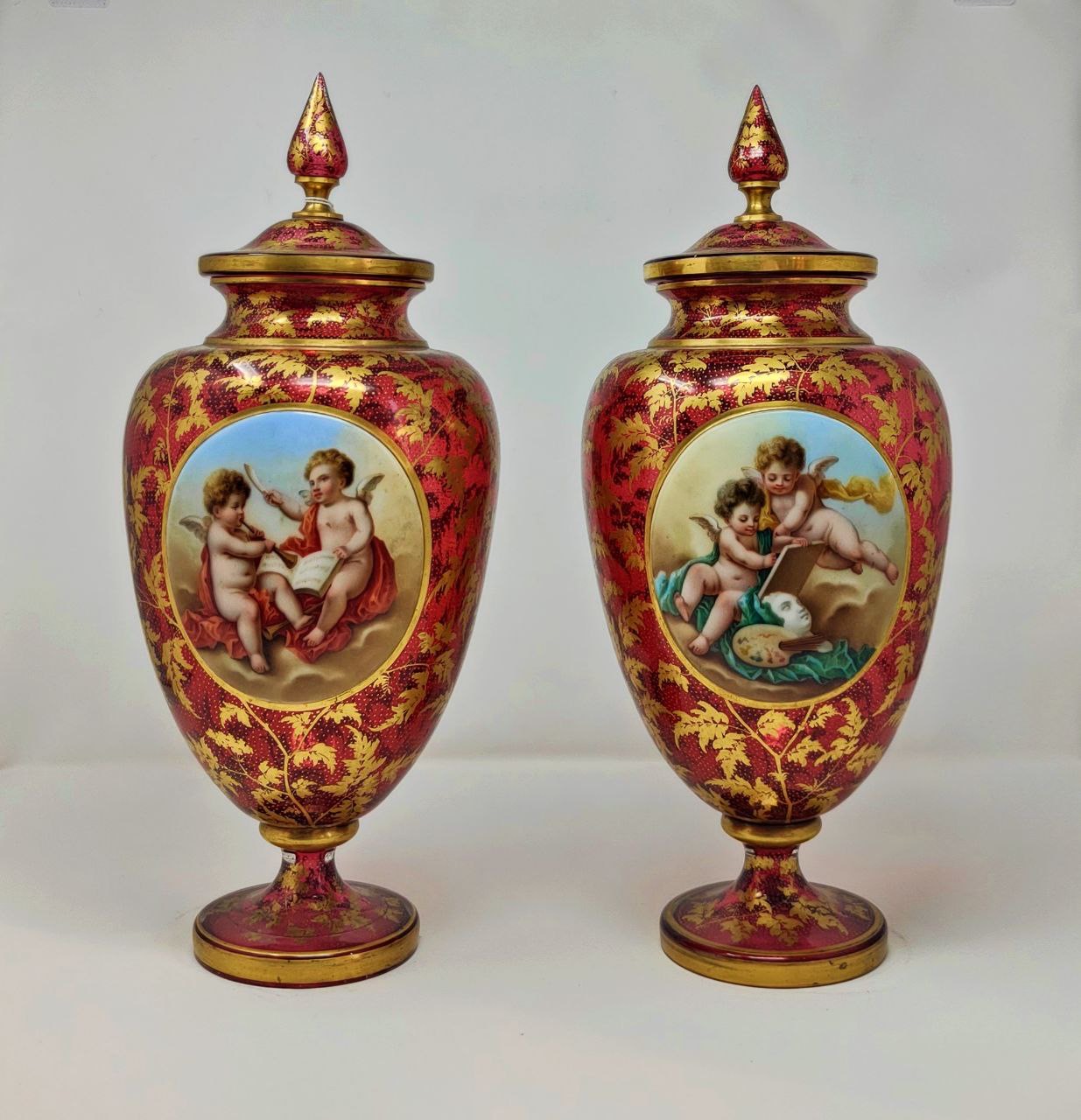 Pair of bohemian glass lidded urns 