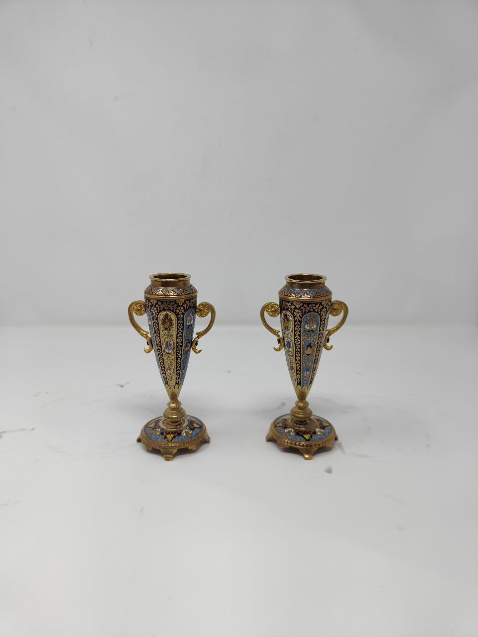A pair of Bronze champleve enamel vases